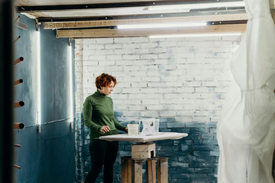 A woman painting her basement.