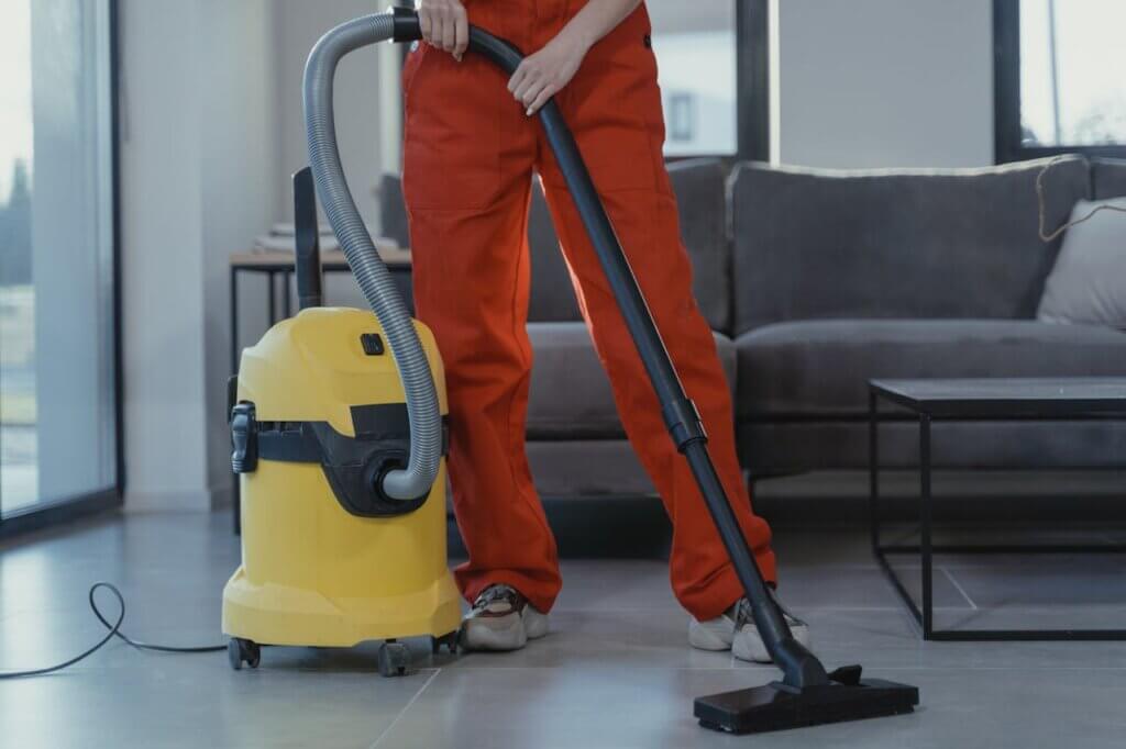 Top Tips For Maintaining A Pest-Free Home After Relocating. Man Vacuuming. 