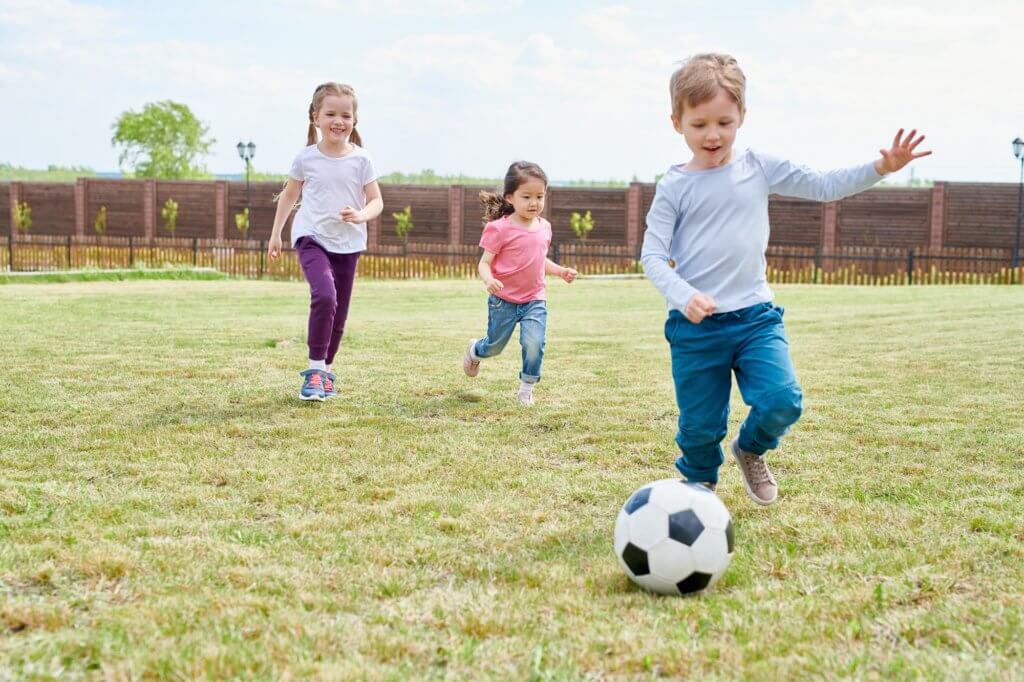 Kids playing outside and incorporating exercise.