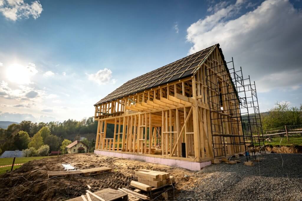 Residential home construction, frame wooden house outdoor.