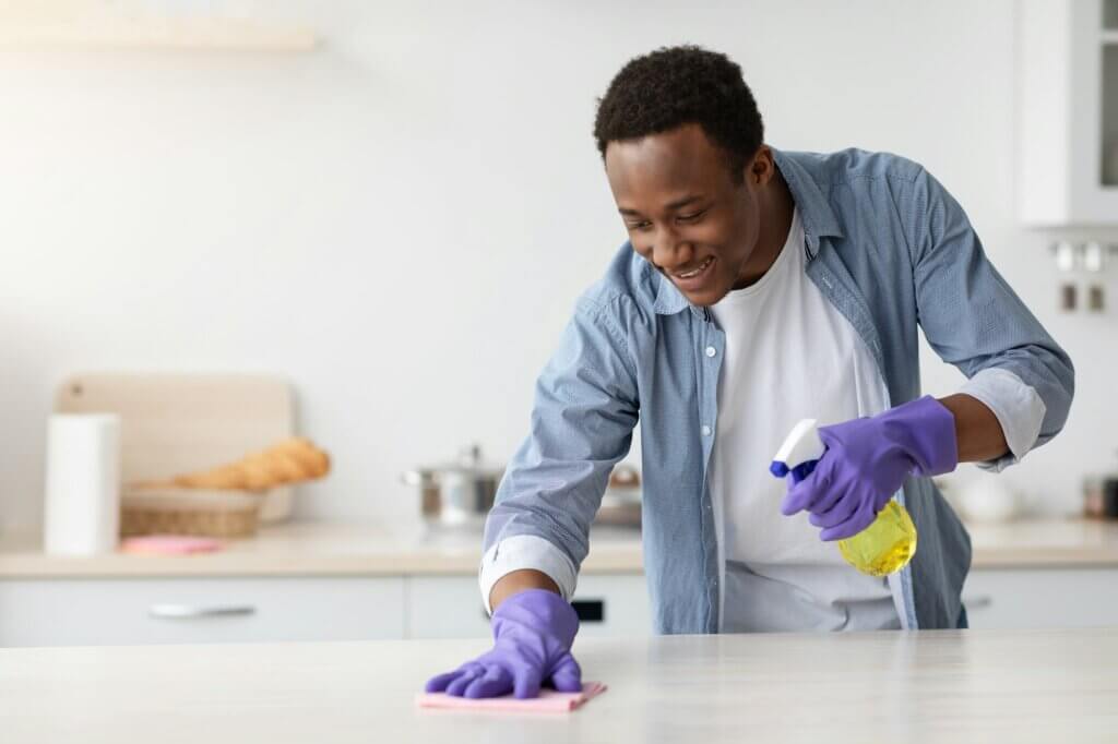 Preventive Measures To Keep Pests Away. Man cleaning.
